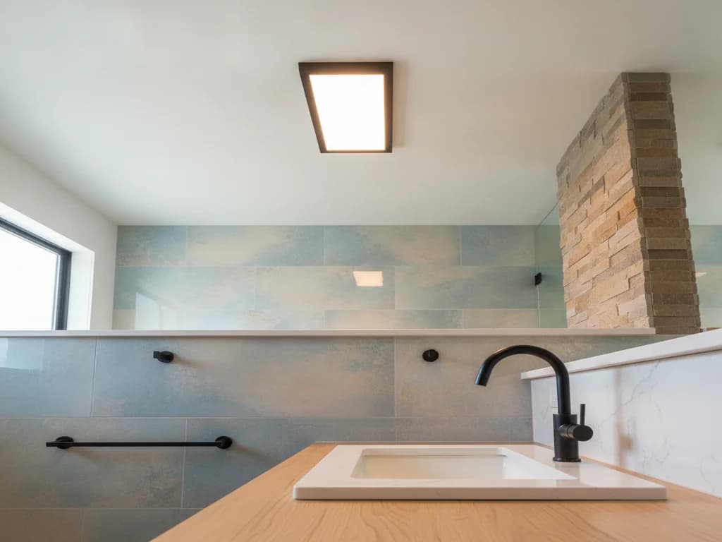 Replacing Bathroom Light Fixtures: Ratings, Housings, and What It Involves